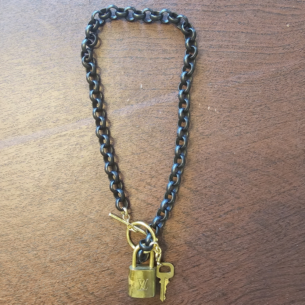 LOUIS VUITTON brass and blacker choker necklace.